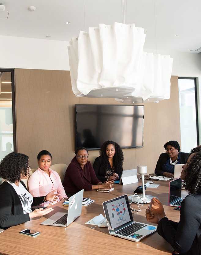 Members meeting around a boardroom table