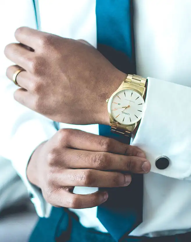A businessman adjusting his cufflinks